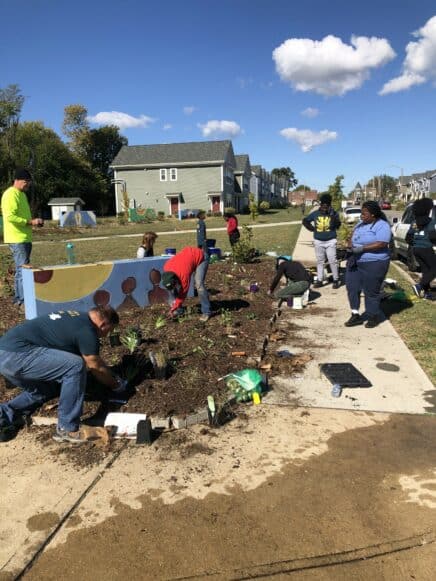 Neighbors working together at Triangle Park.